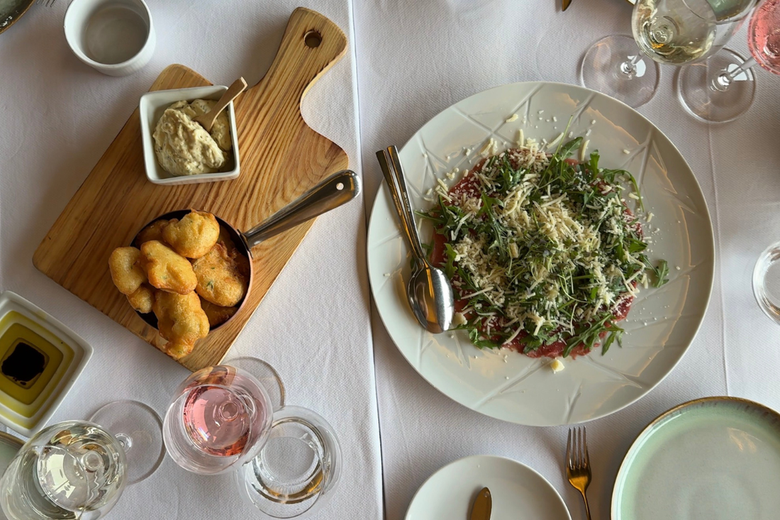 Glass of Fria Frio Vinho Verde White and Rosé with fish and a summer salad